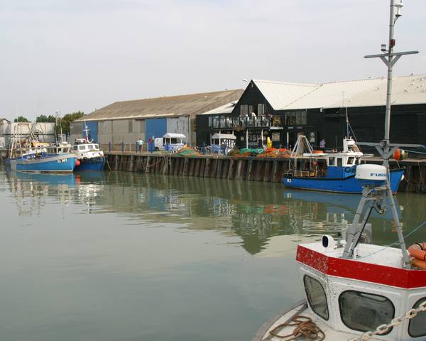 Fishing boats and the fish market in Whitstable harbour